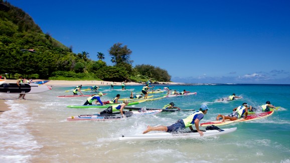 A race from shore into the surf kicks off the Na Pali Race. Competitors will have to make good choices along the waves to maximize speed with minimal effort. Lia Barrett