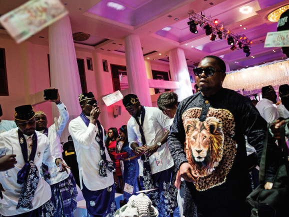 A posh wedding in Lekki filled with guests from the music and film industries and complete with “spraying”— throwing money in the air in the bride and groom’s direction.